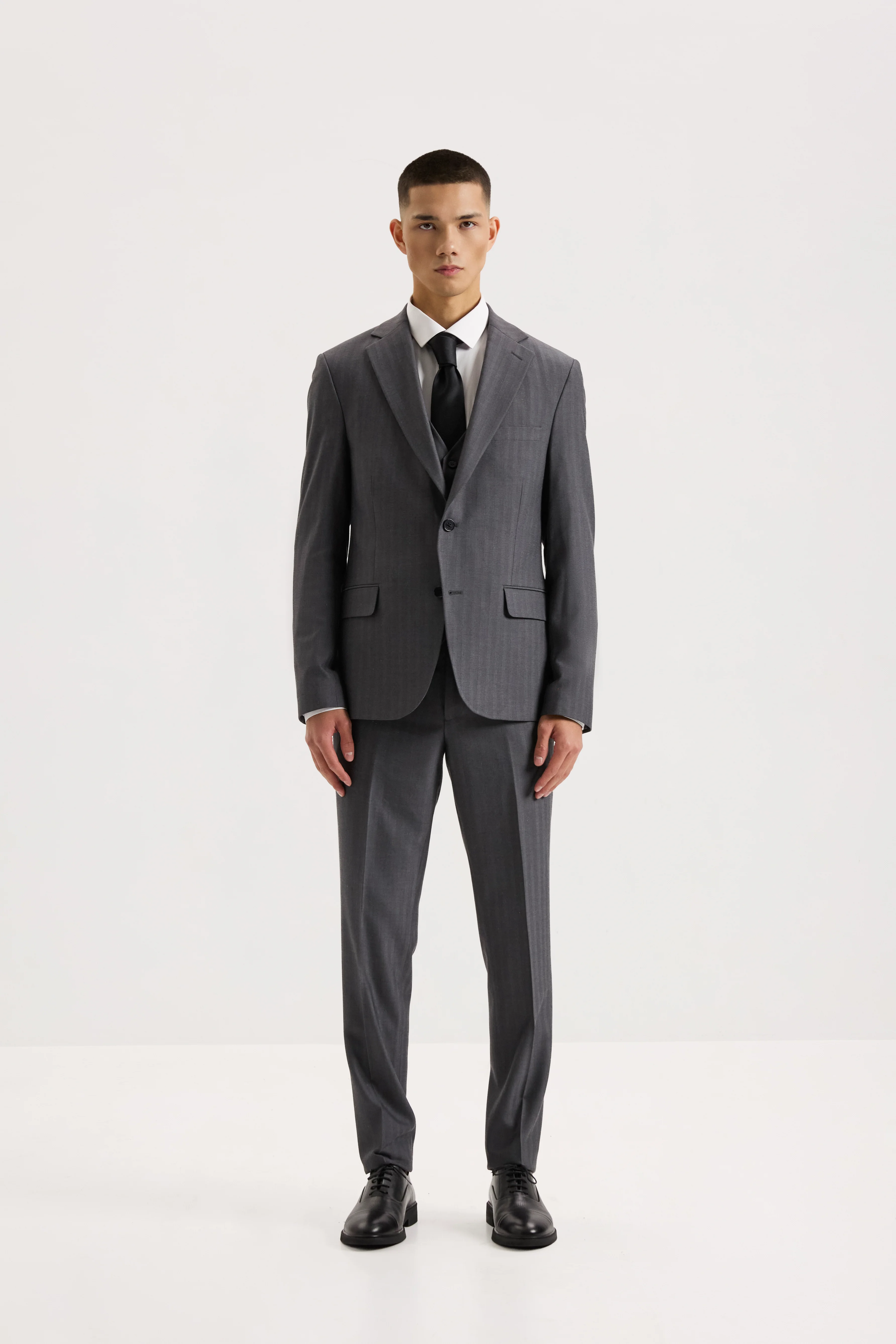 Чоловічий костюм-трійка з вовною сірий з вкрапленнями